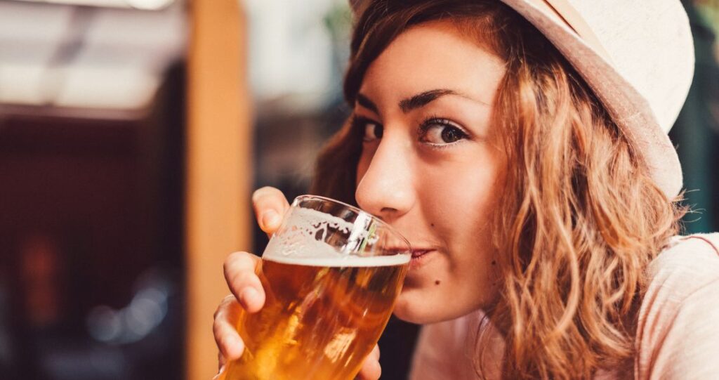 Image of woman enjoying a beer