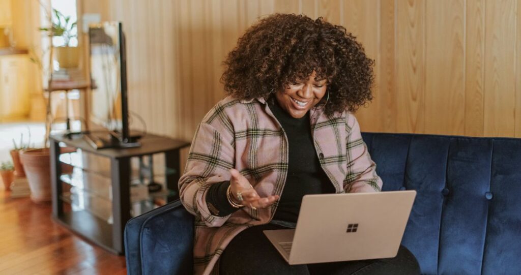 Woman on a video call using a microsoft surface laptop